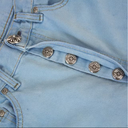 Close-up of leather cross embroidery on jeans