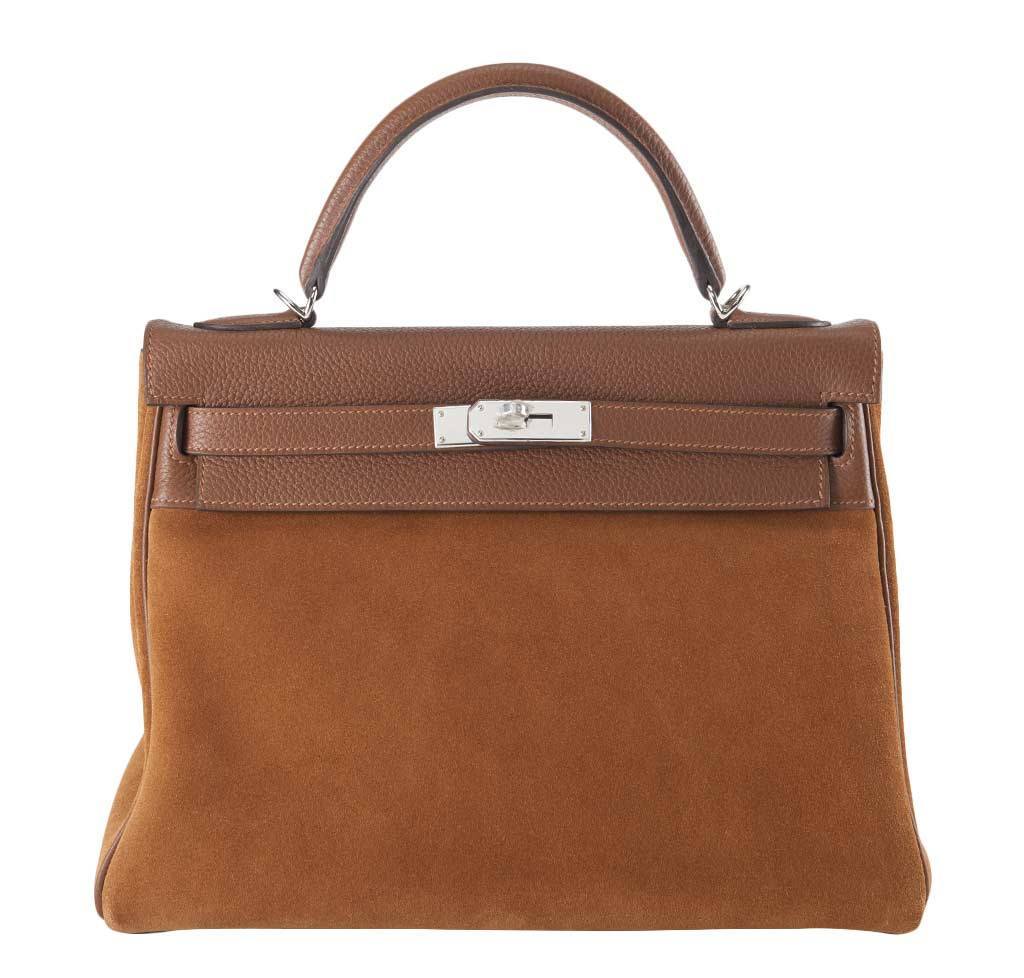 Brown handbag with a silver clasp on a white background